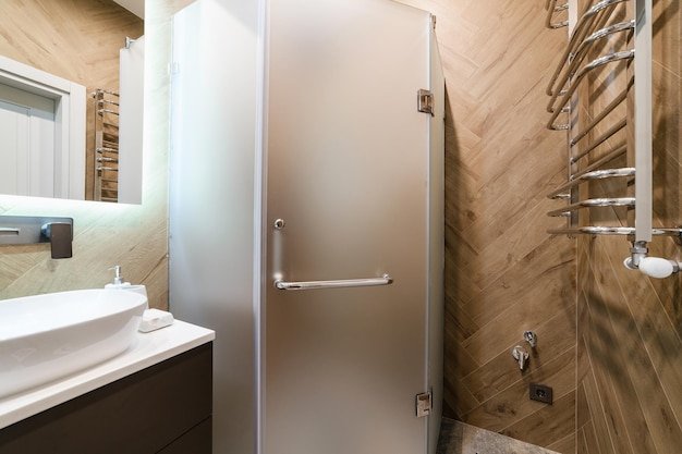 Shower with glass doors in the bathroom
